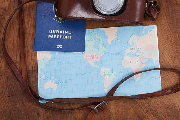 istock map, old camera and passport . Travel concept 517894104