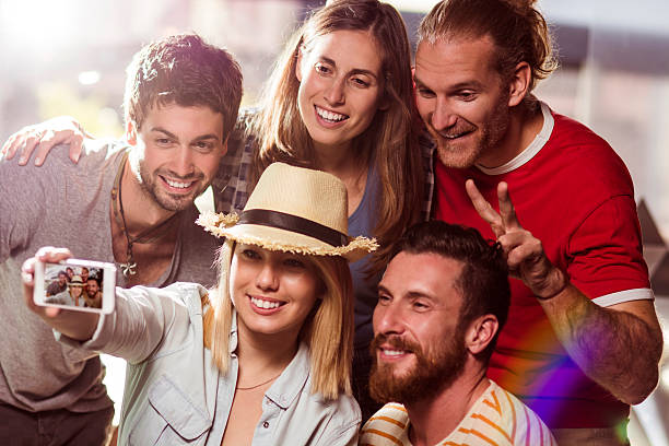 istock Friends having fun and takin selfies 517894506
