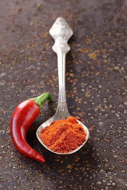 istock red spice paprika pepper on iron old background 517895955