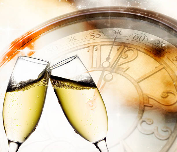 istock Glasses with champagne against holiday lights 517895967