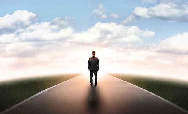 istock Back view businessman walking straight on his way 517896518