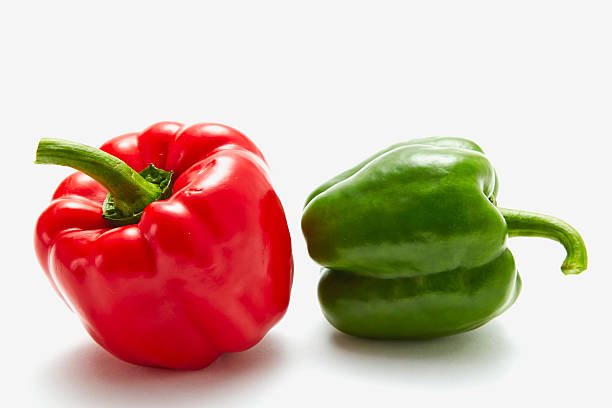istock Red and green sweet pepper isolated on a white background 517896655
