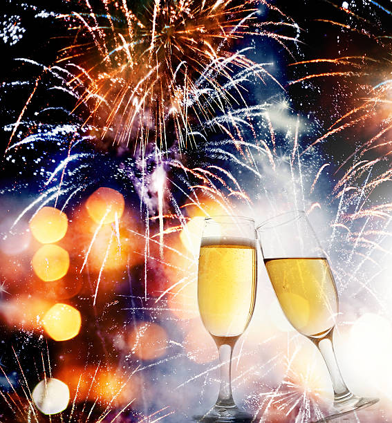 istock Glasses with champagne against holiday lights 517896837