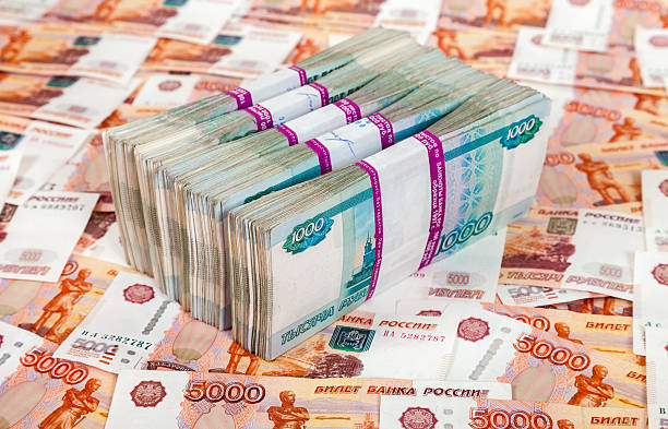 istock Russian rubles bills over money background 517898007