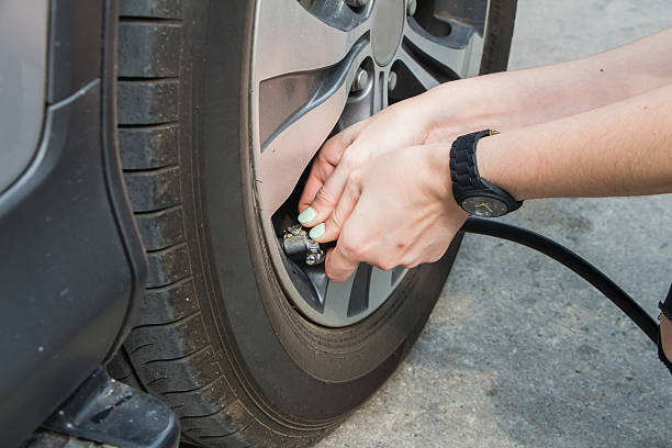 istock The girl inflate tires By her self 517898166