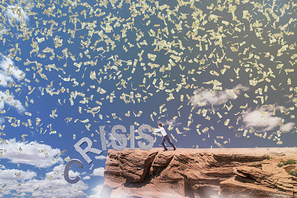 istock Businessman fighting against crisis 517898330