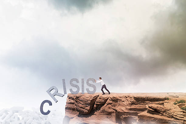 istock Businessman fighting against crisis 517898468
