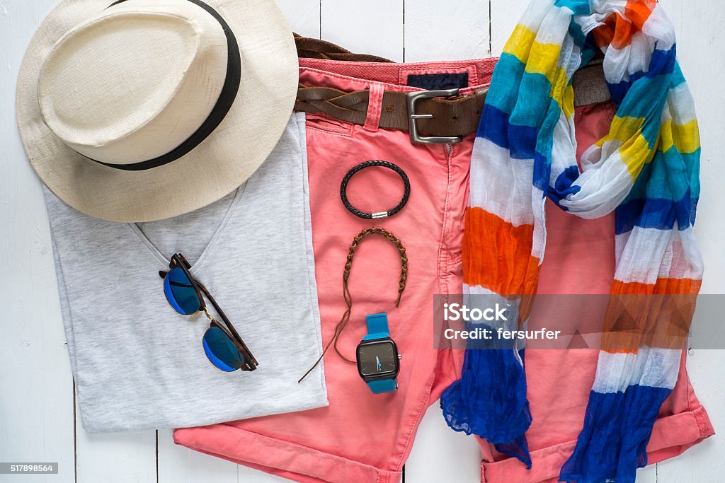 Overhead view of essentials casual travel outfit for man Overhead view of essentials casual travel outfit. Summer clothing, urban clothes. Essentials for traveling light. Fashion Stock Photo