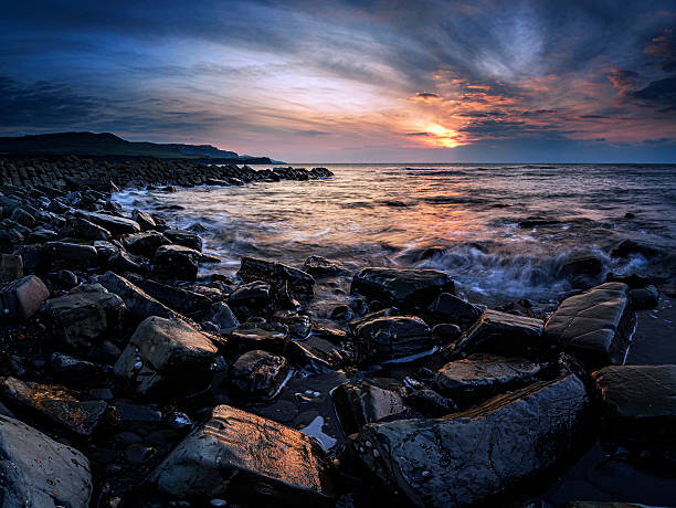 istock Stunning sunset landscape image of rocky coastline 517898998