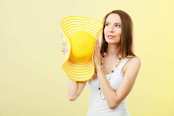 istock Woman in big yellow summer hat. 517899798