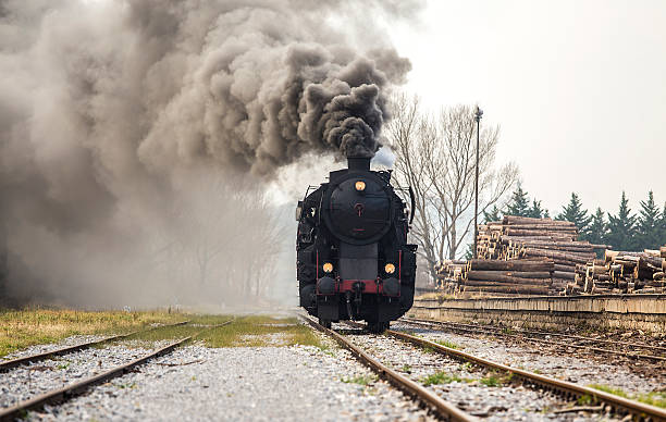 istock Old black steam train on a railway 517900716