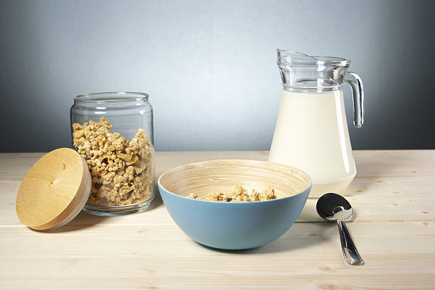 istock Delicious and healthy cereal in bowl with milk on table 517901136