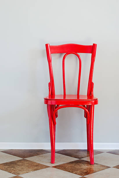 istock Red Chair on a Grey Wall 517901195