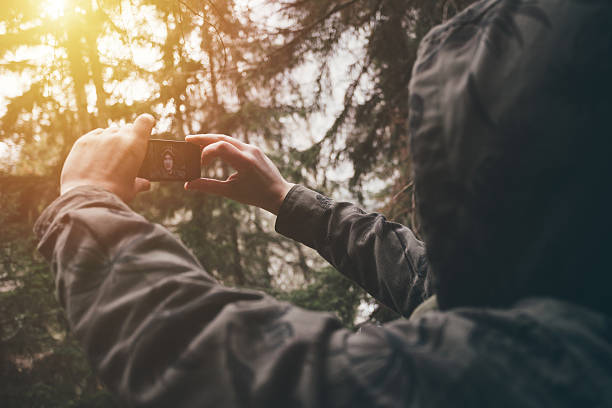 istock Traveler taking selfie in a forest 517901468