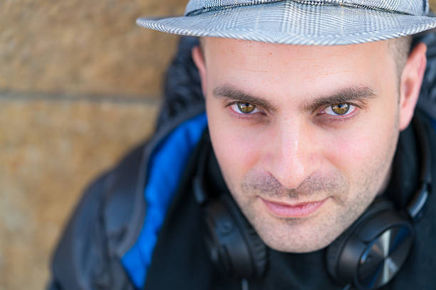 istock Man with headphones on his neck looking at camera 517902420