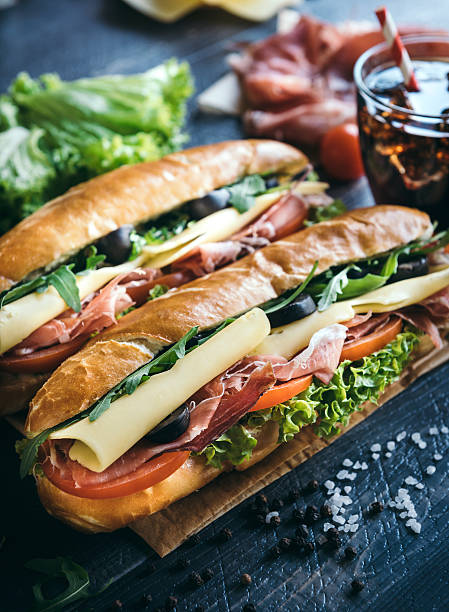 submarino sándwiches servidos - deli sandwich fotografías e imágenes de stock