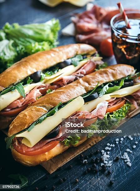 Submarine Sandwiches Served Stock Photo - Download Image Now - Sandwich, Baguette, Submarine Sandwich