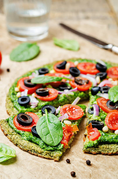 istock vegan broccoli zucchini pizza crust with vegetables 517902864
