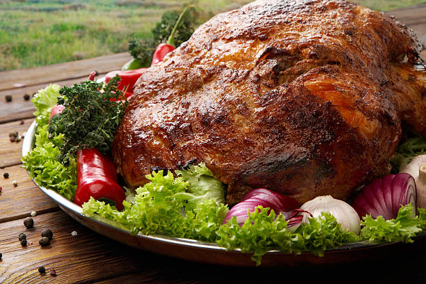 istock Roasted pork shoulder with vegetables, meat dish 517904052
