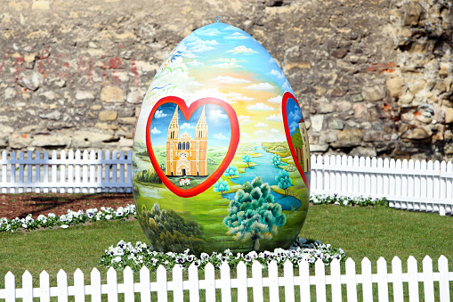 Zagreb, Croatia - March 26, 2016 : Three easter eggs painted with technique naive by hand are placed on the Kaptol square in front of Zagreb Cathedral, Croatia.