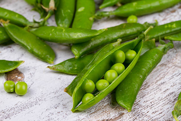 istock Young fresh juicy green peas 517905242
