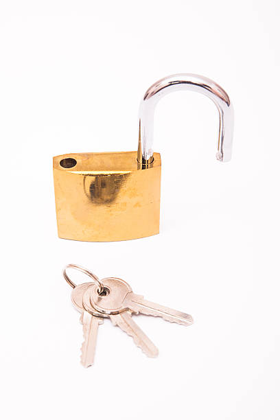 istock Unlocked Golden Padlock And Key Isolated On White Background, Closeup 517905620