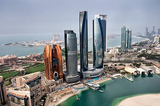Helicopter point of view of Abu Dhabi skyline with surrounding area.