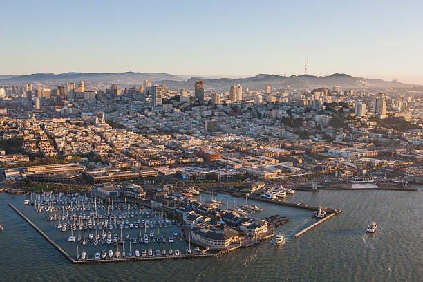 Pier 39, North Beach, Nob Hill aerial view San Francisco An aerial photo of the Pier 39 and Pier 41 area of San Francisco with North Beach, Little Italy, and Nob Hill neighborhoods.  Also visible is Sutro Tower on the horizon.   fishermans wharf san francisco photos stock pictures, royalty-free photos & images