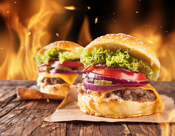 istock Home-made hamburgers with fire 517923783