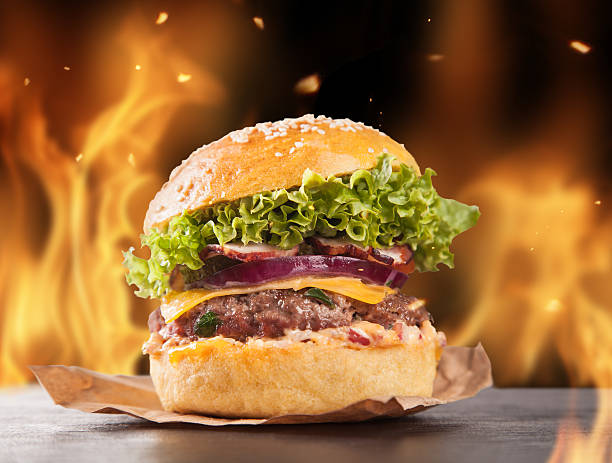 istock Home-made hamburgers with fire 517923791