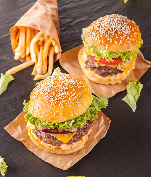 istock Fresh hamburgers served on black stone 517923795
