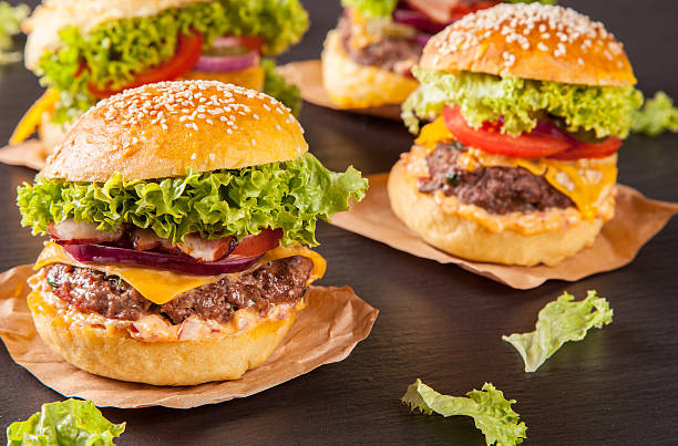 istock Fresh hamburgers served on black stone 517924173