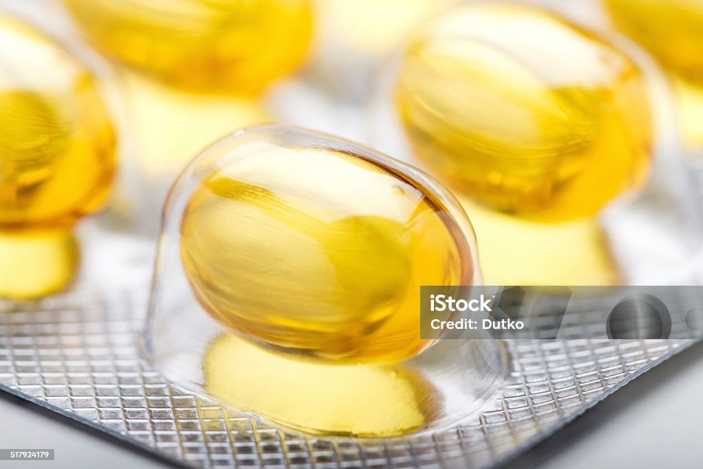 Fish oil capsules close-up Close-up of fish oil capsules in blister Acid Stock Photo