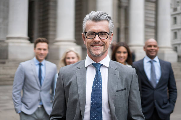istock Senior man leading a business group 517925528