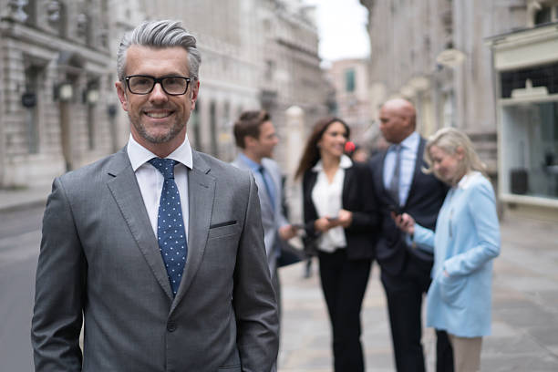 istock Senior business man with a group 517925702