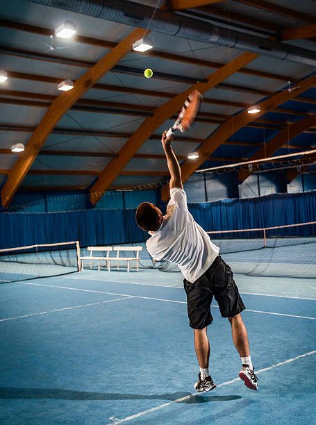 istock Indoors Tennis Serving Action 517926681