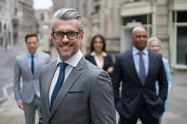 istock Senior business man leading a group 517927792