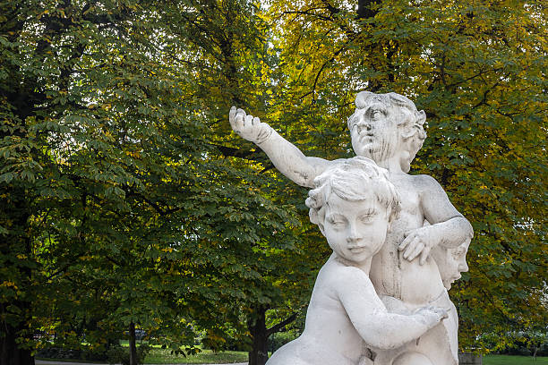 Statue of little angels in a outdoor park in Vienna, Austria