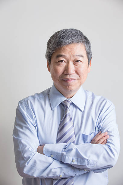 istock senior businessman with crossed arms 517928130