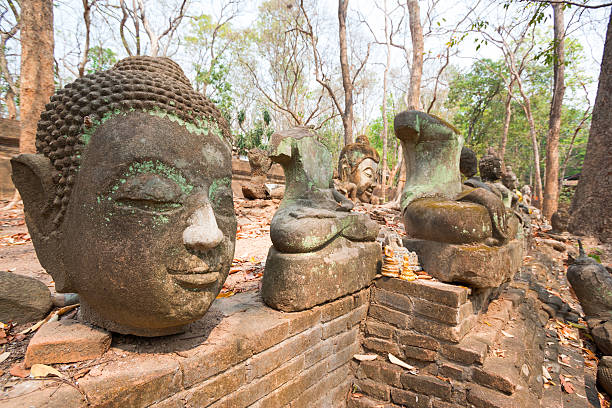 istock Head of Buddha statue in forest at Wat Umong 517929324