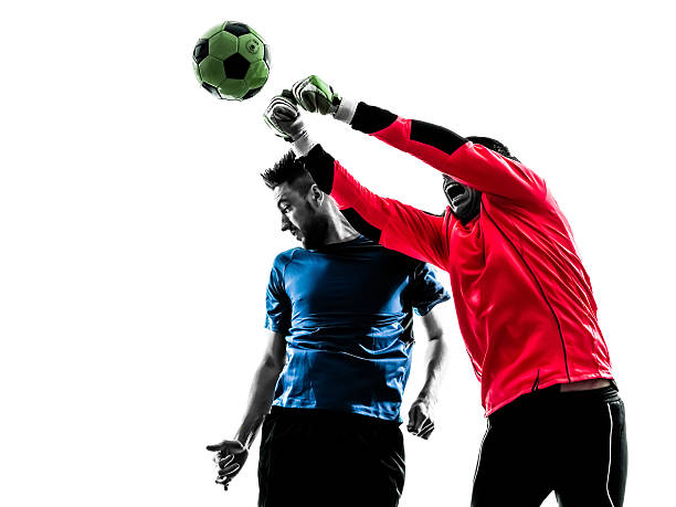 istock two men soccer player goalkeeper punching heading ball competiti 517929653