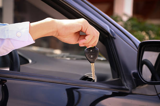 istock Business man showing key 517929674