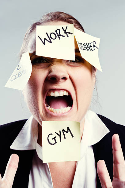istock Angry, over committed businesswoman shouts her frustration 517930205