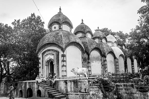 Kolkata, India - July 19, 2014: A row of six Shiva Temple or the bank on river ganga in Sodpur Kolkata. The temples are more than 100 years old and are classic example of Bengali Hindu Architecture. 