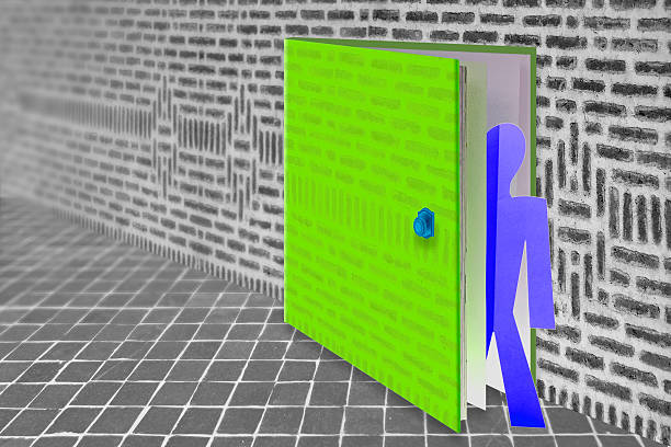 istock man coming out of book, education Concept 517931131