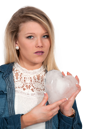 Woman holding a heart made of ice