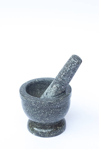 istock Stone mortar and pestle on white background 517932892