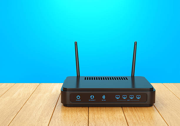 wi-fi na drewniany stół ruter - router wireless technology computer part node zdjęcia i obrazy z banku zdjęć