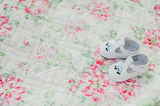 children's clothing and shoes on wooden background