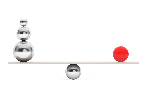 istock Chrome Balancing Balls over Wooden Board 517936268